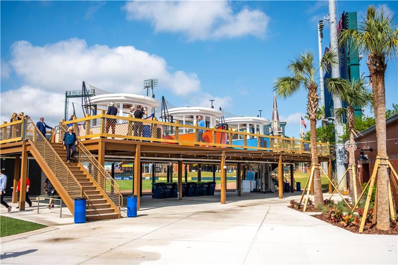 A dock surrounds seating areas designed to look and feel like three shrimp boats for the Jacksonville Jumbo Shrimp Triple-A baseball team.