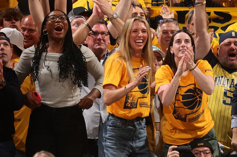INDIANAPOLIS, IN - MAY 31: Aliyah Boston #7, Lexie Hull #10 and Caitlin Clark #22 of the Indiana Fever celebrate during the game between the New York Knicks and the Indiana Pacers during Game 6 of the 2025 Eastern Conference Finals on May 31, 2025 at Gainbridge Fieldhouse in Indianapolis, Indiana. NOTE TO USER: User expressly acknowledges and agrees that, by downloading and or using this Photograph, user is consenting to the terms and conditions of the Getty Images License Agreement. Mandatory Copyright Notice: Copyright 2025 NBAE (Photo by Nathaniel S. Butler/NBAE via Getty Images)