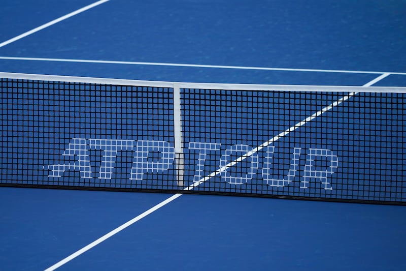 A detailed view of an ATP TOUR logo on a tennis net during the semifinal round of the Western & Southern Open at Lindner Family Tennis Center.
