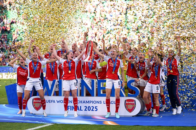 LISBON, PORTUGAL - MAY 24:  Kim Little and Leah Williamson of Arsenal lifts the UEFA Women's Champions League trophy after their team's victory in the UEFA Women's Champions League final match between Arsenal WFC and FC Barcelona at Estadio Jose Alvalade on May 24, 2025 in Lisbon, Portugal. (Photo by David Ramos/Getty Images)