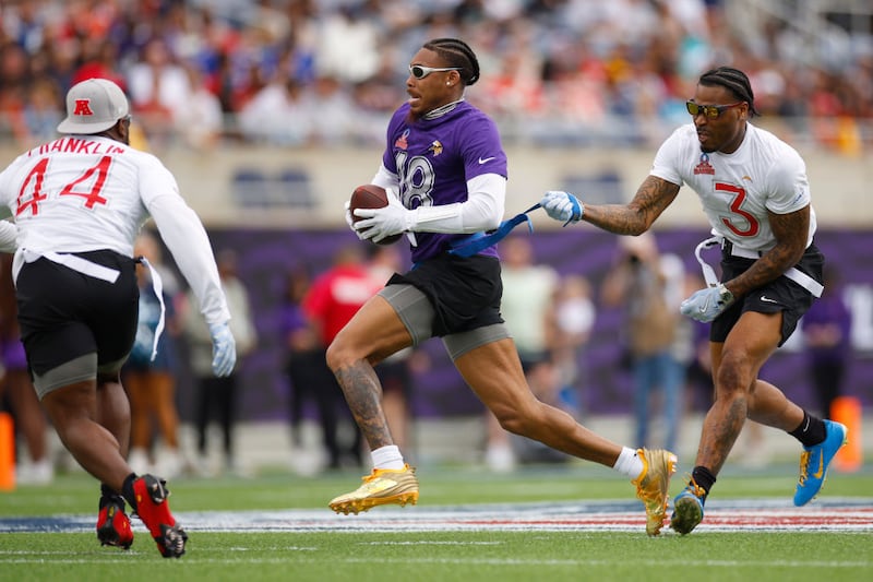 Justin Jefferson #18 of the Minnesota Vikings has his flag pulled by Derwin James Jr. #3 of the Los Angeles Chargers during the first quarter in the NFL Pro Bowl Games