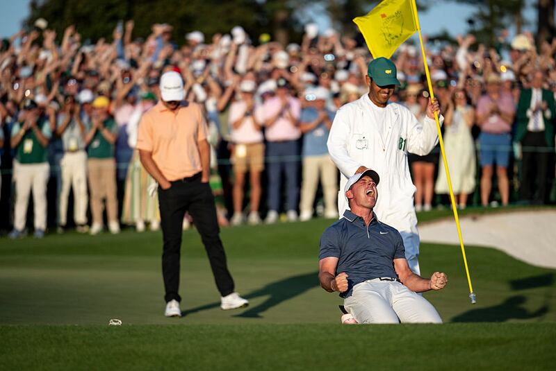Masters champion Rory McIlroy of Northern Ireland celebrates after winning the Masters in a sudden death playoff on the No. 18 green at Augusta National Golf Club