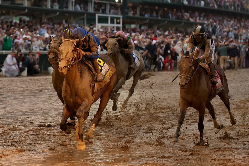 LOUISVILLE, KENTUCKY - MAY 03: Sovereignty #18, ridden by jockey Junior Alvarado crosses the finish line to win the 151st running of the Kentucky Derby at Churchill Downs on May 03, 2025 in Louisville, Kentucky. (Photo by Michael Reaves/Getty Images)